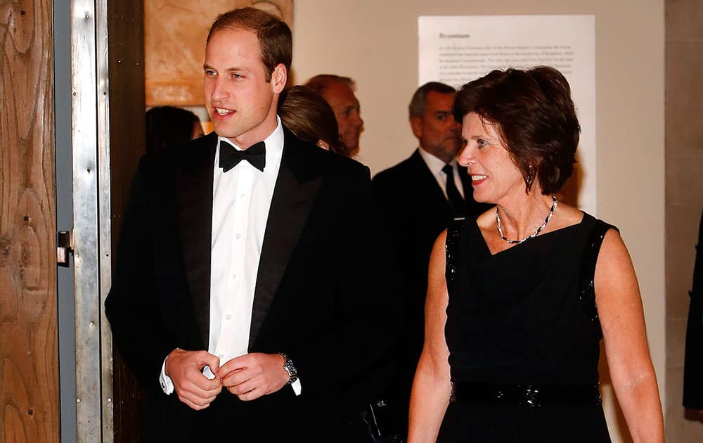 Britain's Prince William, the Duke of Cambridge, walks with Louise Richardson, Vice Chancellor of St Andrews, during the St. Andrews 600th Anniversary Dinner at the Metropolitan Museum of Art, in New York. 