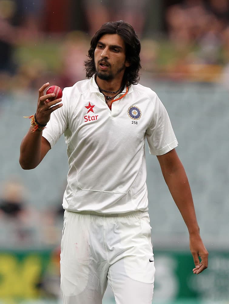 India's Ishant Sharma inspects the ball before bowling to Australia during the second day of their cricket Test match in Adelaide, Australia.