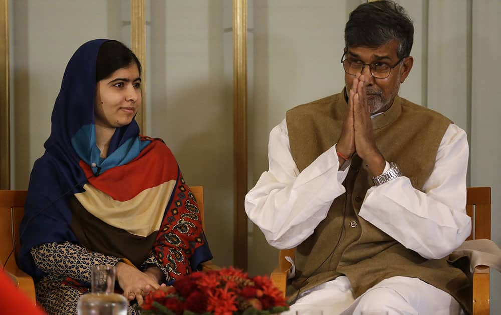 Joint-Nobel Peace prize winners Malala Yousafzai, left, and Kailash Satyarthi attend a press conference in Oslo, Norway.  The Nobel Peace Prize will be presented to and shared between the youngest Nobel Prize winner ever, 17-year-old Taliban attack survivor Malala Yousafzai and Indian children's rights activist Kailash Satyarthi in a ceremony in Oslo on Wednesday.