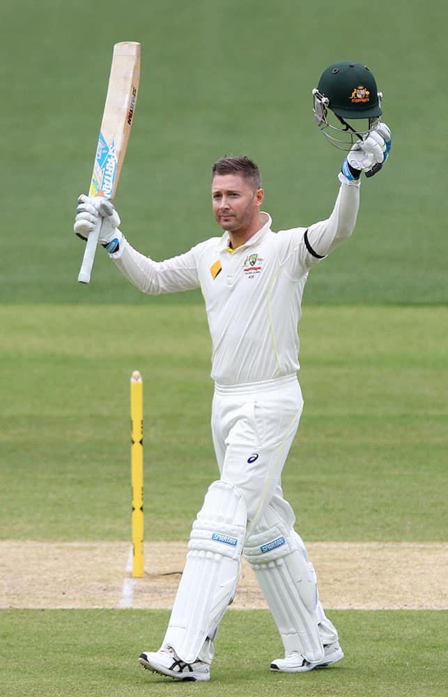 Australia's Michael Clarke celebrates making 100 runs during the second day of their cricket test match against India in Adelaide, Australia.