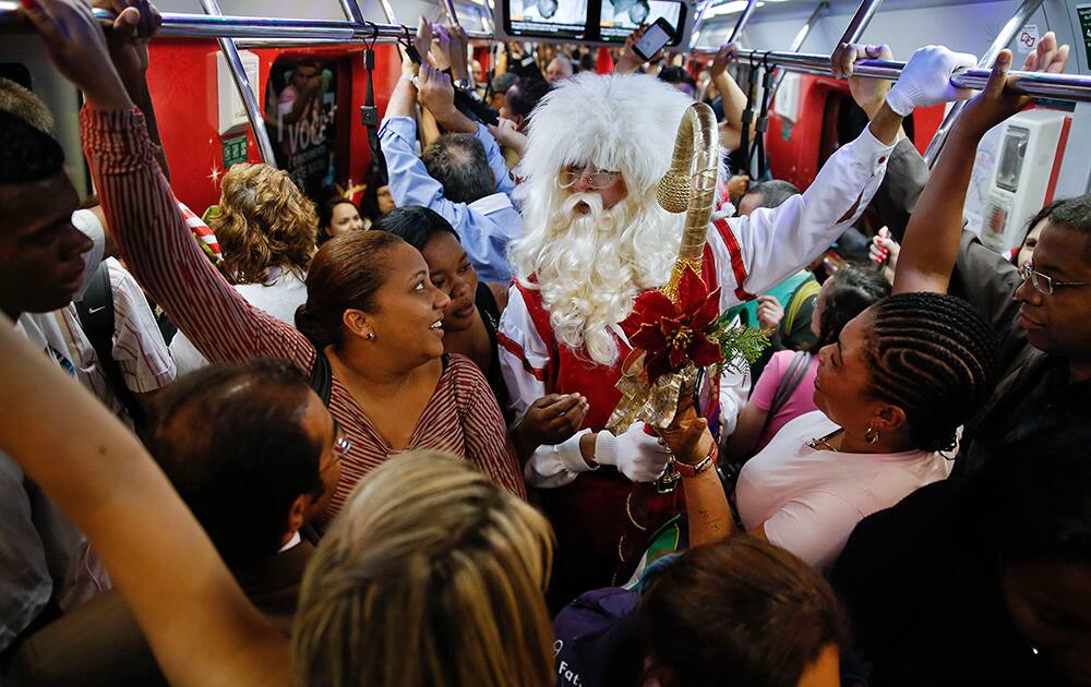 A man dressed as Santa Claus rides a crowded subway train in Sao Paulo, Brazil.