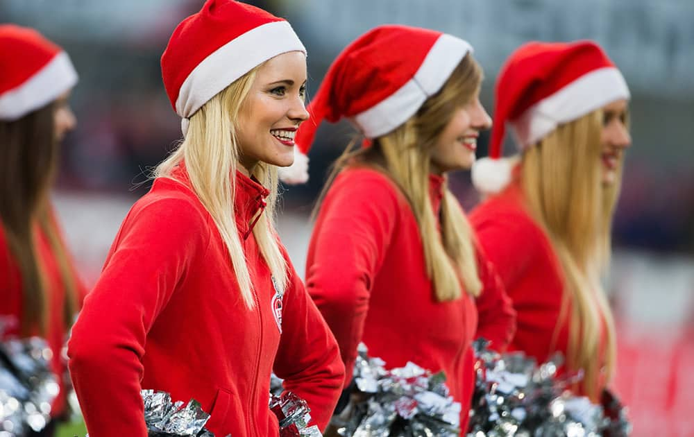 Cologne Cheerleaders in Christmas outfit perform before the German first division Bundesliga soccer match betweeen 1. FC Cologne and FC Augsburg in Cologne, western Germany.