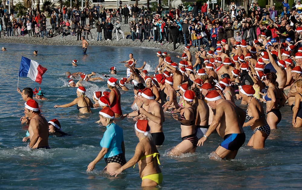 People go swimming during the traditional Christmas bath in the Mediterranean sea at Cagnes sur Mer, near Nice, southeastern France.