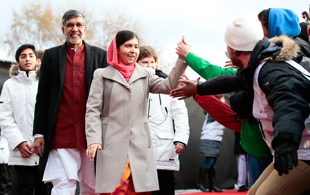 Nobel Peace Prize laureates Kailash Satyarthi and Malala Yousafzai arrive at Save the Children (Redd Barna) peace prize festivities in Oslo.