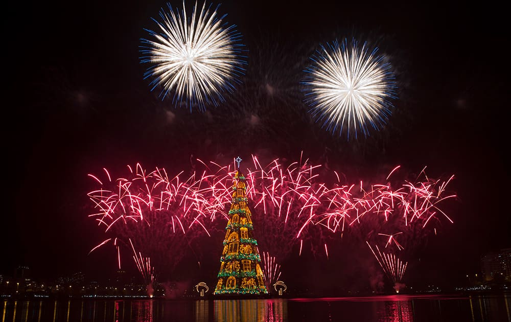 Fireworks explode over the floating Christmas tree in Lagoa lake at the annual holiday tree lighting event in Rio de Janeiro, Brazil.