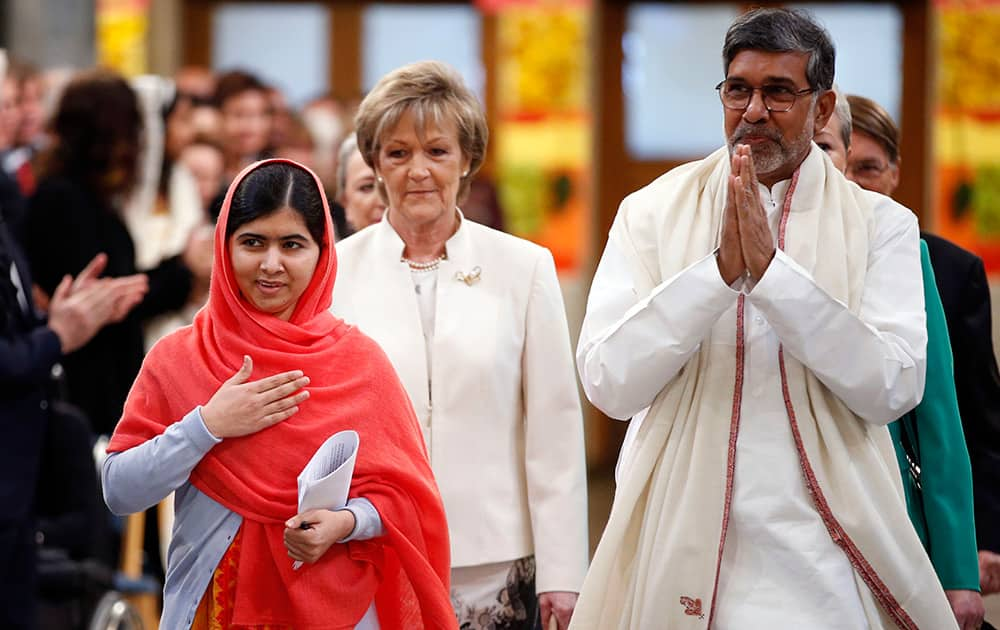 Nobel Peace Prize winners Malala Yousafzai from Pakistan, and Kailash Satyarthi of India arrive for the Nobel Peace Prize award ceremony in Oslo, Norway.