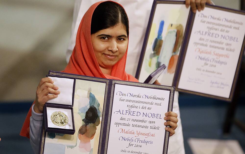 Nobel Peace Prize winners Malala Yousafzai from Pakistan, front, and Kailash Satyarthi of India are awarded their Nobel Peace Prize during the Nobel Peace Prize award ceremony in Oslo, Norway.