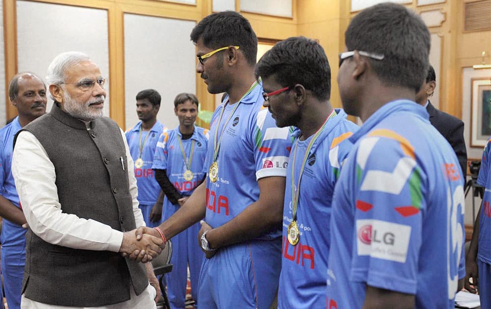 Prime Minister Narendra Modi meeting the members of the Blind World Cup winning Indian cricket team in New Delhi.