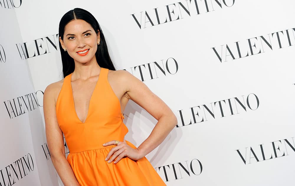 Actress Olivia Munn attends the Valentino Sala Bianca 945 Haute Couture Fashion celebration in New York.