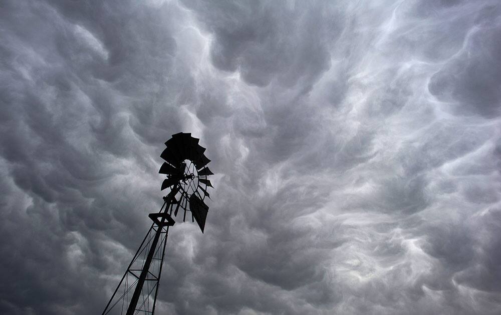 Dark storm clouds hover over rural farmland just north of Walla Walla, Wash. Rain is forecast for Thursday and Friday in the area. 