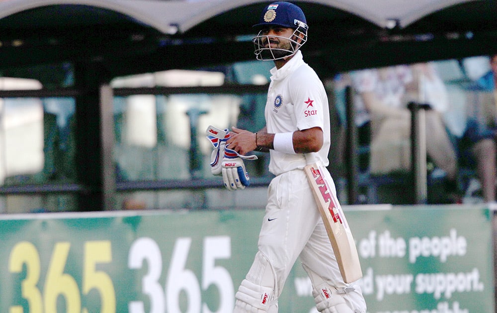 Virat Kohli walks off after he was caught out for 115 runs against Australia during the third day of their cricket test match in Adelaide, Australia.