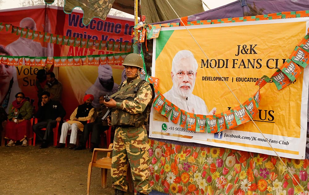 A paramilitary soldier stands guard during an election campaign rally addressed by India's ruling Bharatiya Janata Party (BJP) President Amit Shah in Srinagar, Kashmir.