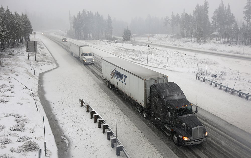 Vehicles make their way along eastbound Interstate 80 near Soda Springs, Calif. 