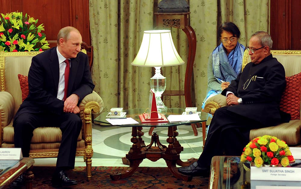 Russian President Vladimir Putin and Indian President Pranab Mukherjee meet in New Delhi.