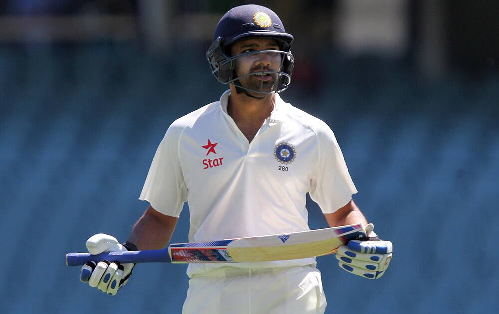 Rohit Sharma walks from the filed after he was dismissed during the fourth day of their cricket test match in Adelaide.