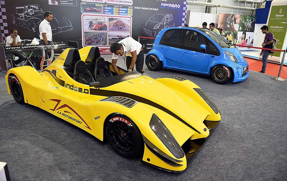 People look at the car displayed at the Autocar Performance Show 2014 in Mumbai.