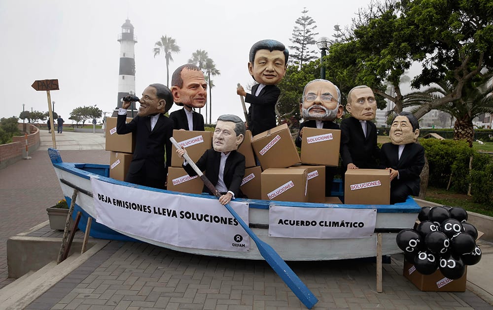 Activists perform as heads of state, President Barack Obama, Australia's Prime Minister Tony Abbott, Canada's Prime Minister Stephen Harper, China's President Xi Jinping, India's Narendra Modi, Russia's President Vladimir Putin and Japan's Prime Minister Shinzo Abe during the Climate Change Conference COP20 in Lima Peru.