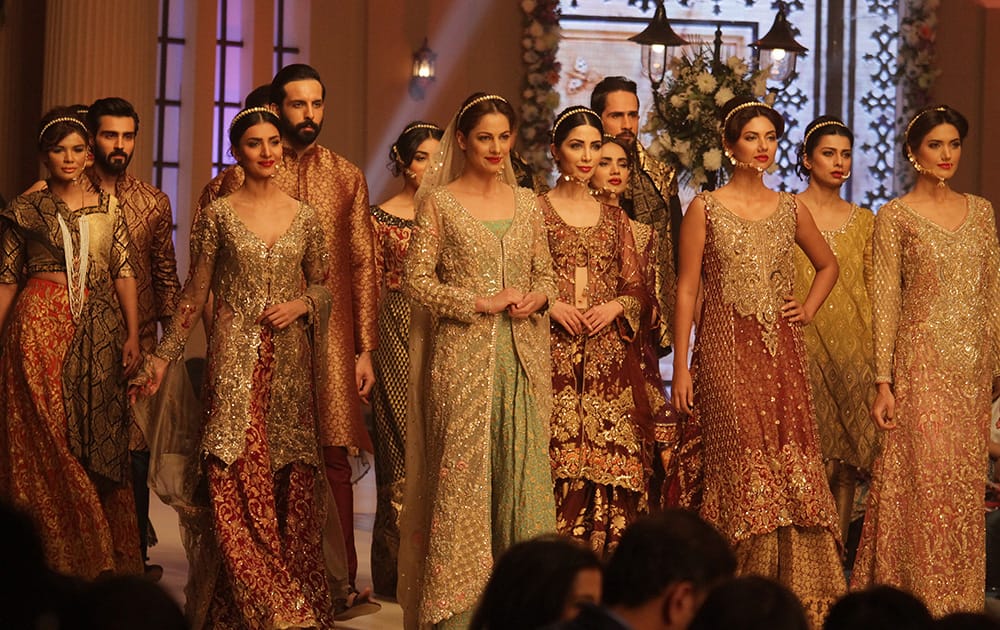 Pakistani models present creations by Pakistani designer Saira Rizwan during the Telenor Bridal Couture Week 2014, in Lahore, Pakistan.