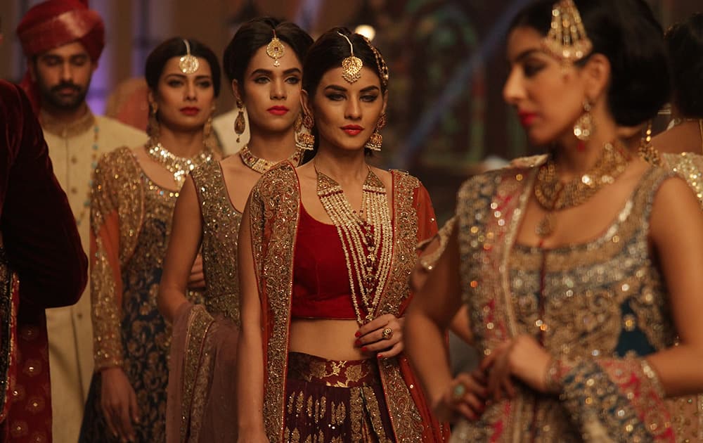 Pakistani models present creations by Pakistani designer Aisha Imran during the Telenor Bridal Couture Week 2014, in Lahore.