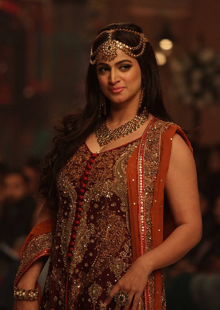 A Pakistani model presents creations by Pakistani designer Aisha Imran during the Telenor Bridal Couture Week 2014, in Lahore, Pakistan.