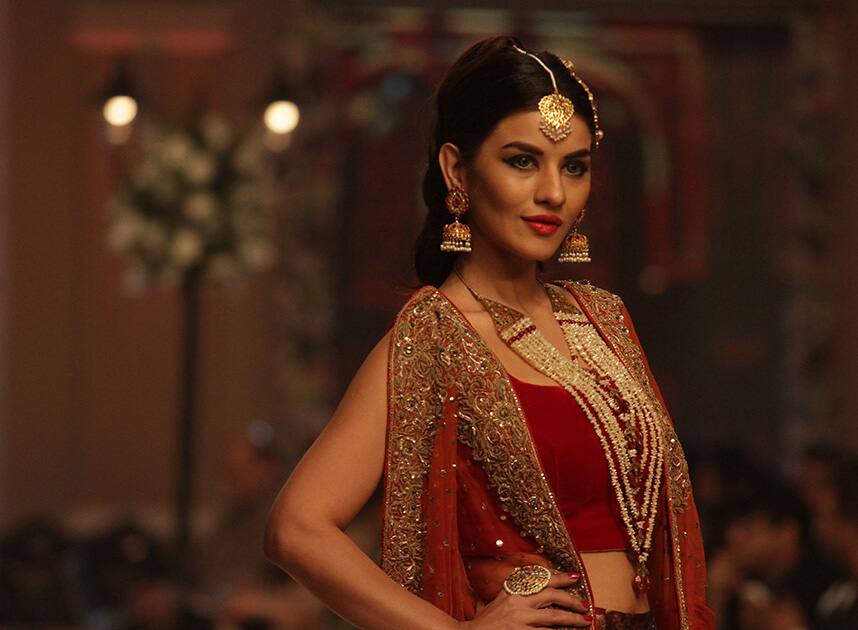 A Pakistani model presents creations by Pakistani designer Aisha Imran during the Telenor Bridal Couture Week 2014, in Lahore, Pakistan.