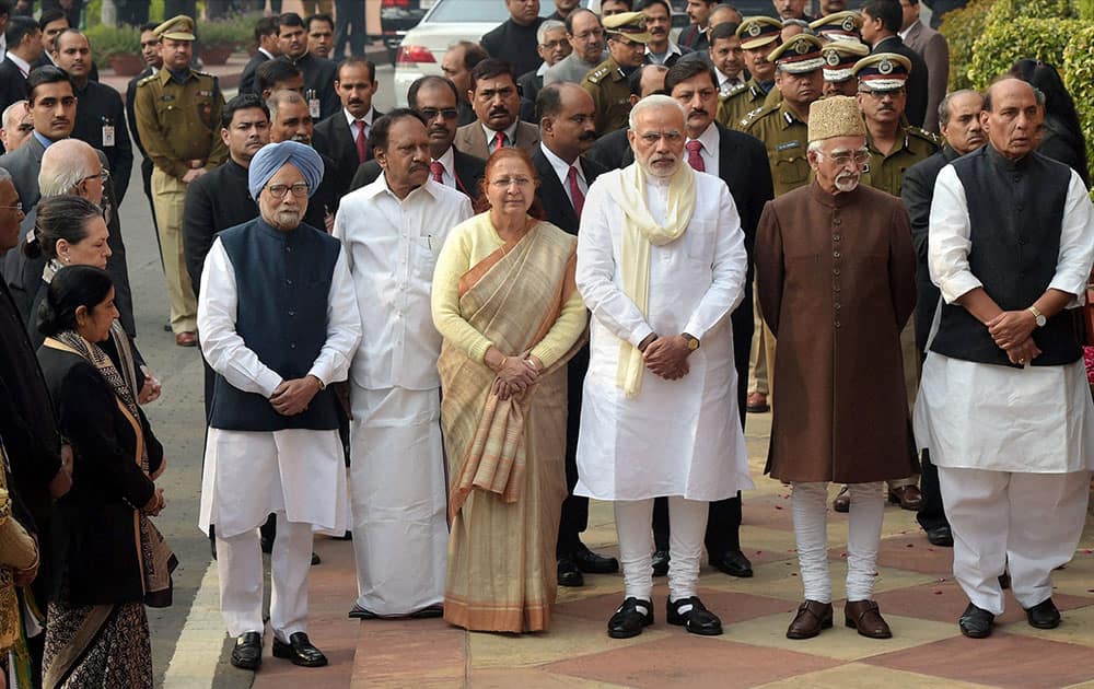 Vice President Mohd Hamid Ansari, Prime Minister Narendra Modi, former PM Manmohan Singh, Lok Sabha Speaker Sumitra Mahajan and other dignitaries during the tribute paying ceremony for the martyrs of 2001 Parliament attack on its 13th anniversary, at Parliament House in New Delhi.