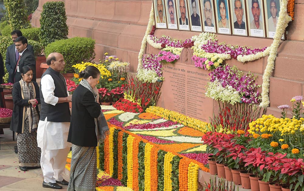 UPA Chairperson Sonia Gandhi, Home Minister Rajnath Singh and External Affairs Minister Sushma Swaraj paying tributes to the martyrs of 2001 Parliament attack on its 13th anniversary, at Parliament House in New Delhi.