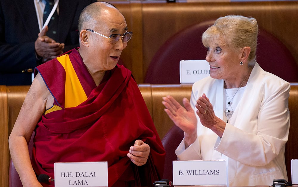 Peace Nobel laureates Tibetan spiritual leader the Dalai Lama, left, and Betty Williams arrive for the last day of the World Summit of Nobel Peace Laureates in Rome.