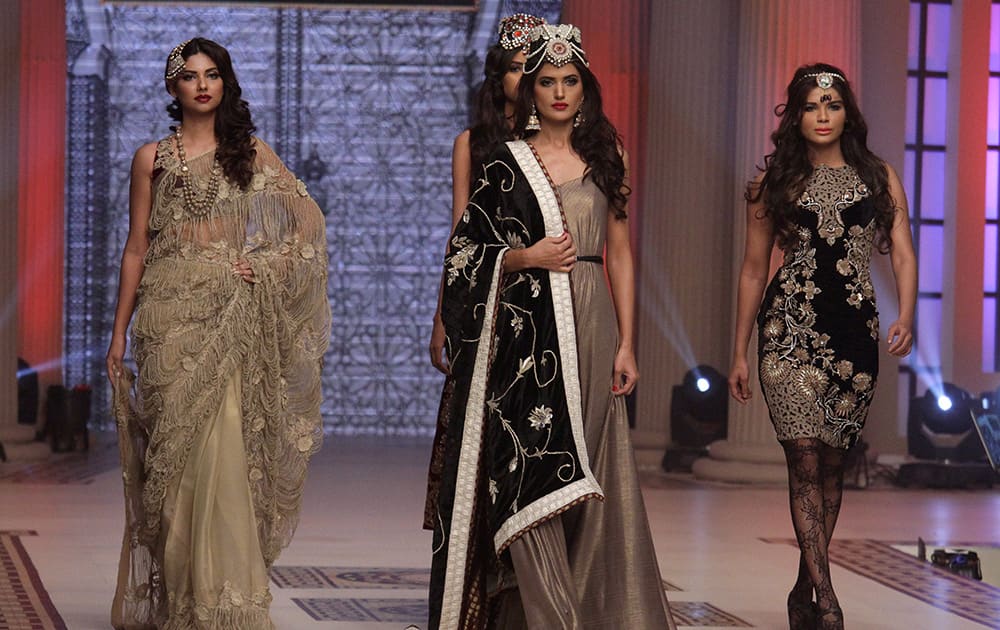 Pakistani models present creations by Pakistani designer Sahar Atif during the second day of Telenor Bridal Couture Week 2014, in Lahore.