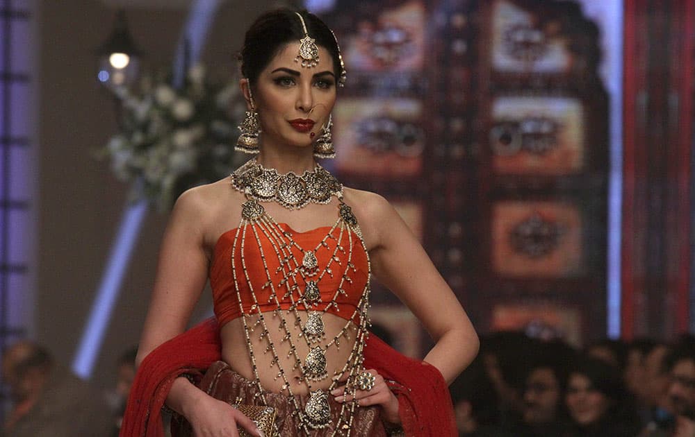 Pakistani models present creations by designer Samreen Vance during the second day of Telenor Bridal Couture Week 2014, in Lahore, Pakistan.