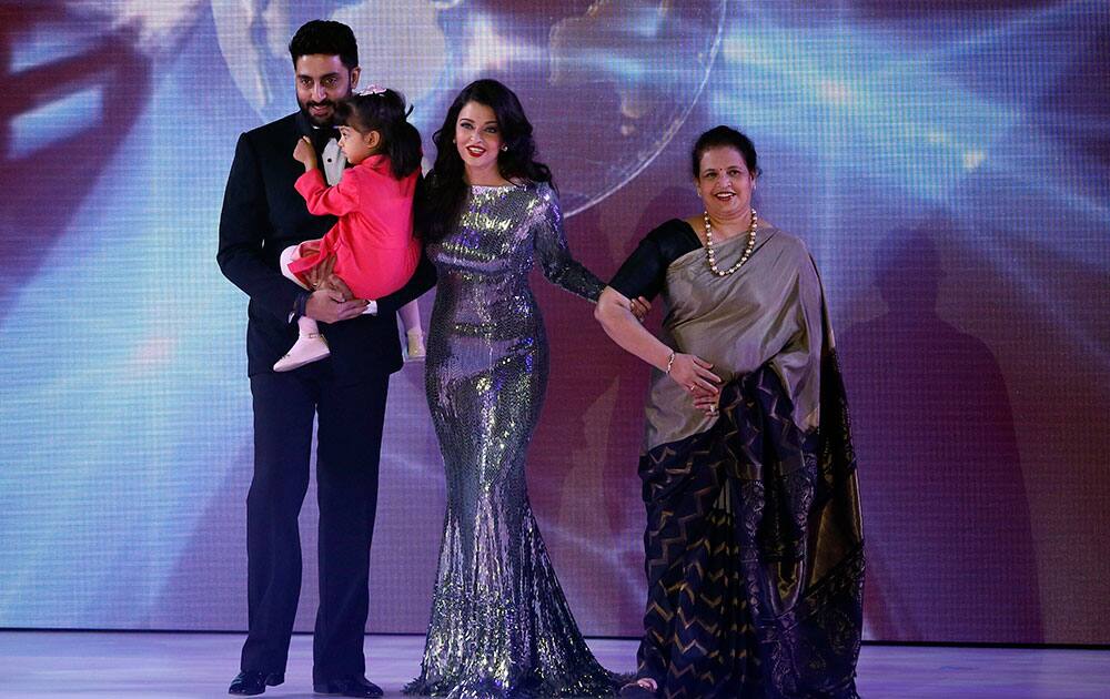 Indian actress Aishwarya Rai Bachchan, a former Miss World walks on the stage with husband Abhishek Bachchan and daughter Aaradhya, and mother Brindya, during the Miss World competition, at the ExCel centre in London.