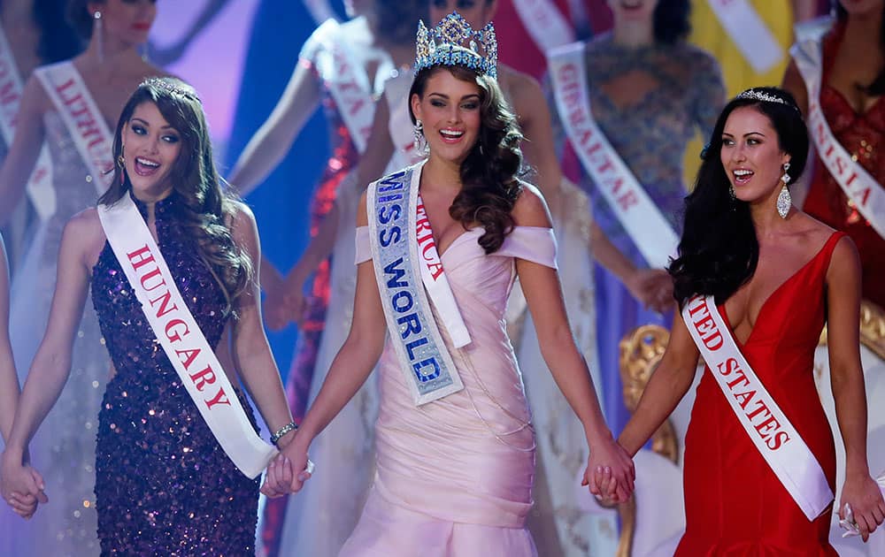 Miss South Africa Rolene Strauss, centre, celebrates after being crowned Miss World 2014, during the finale of the competition at the ExCel centre in London.