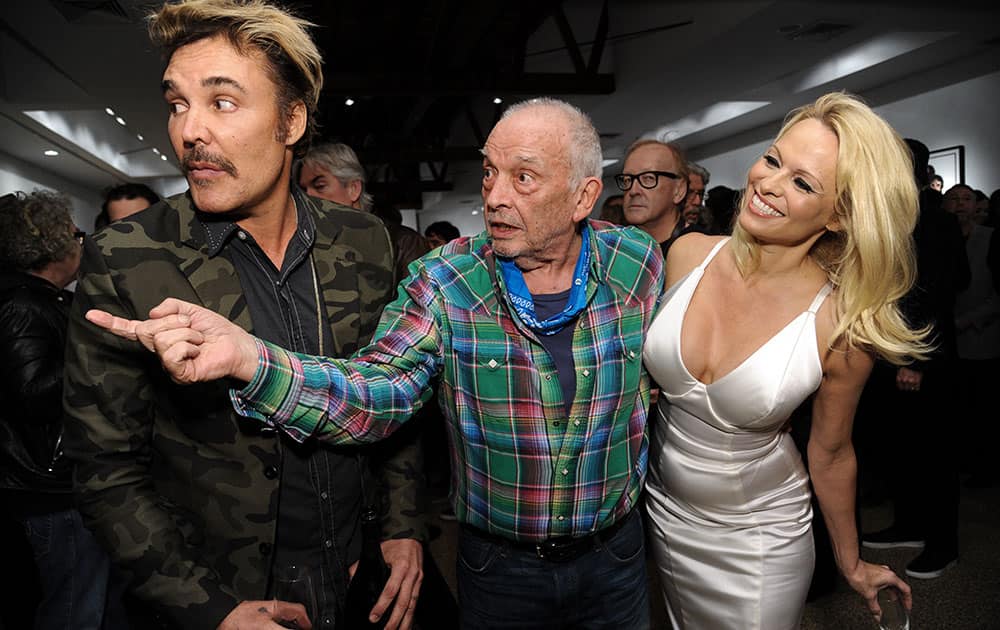 From left, David LaChapelle, David Bailey, and Pamela Anderson attend David Bailey's