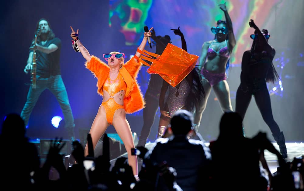 In this Sept. 19, 2014 file photo, U.S. singer Miley Cyrus performs in concert during her Bangerz Tour in Mexico City.