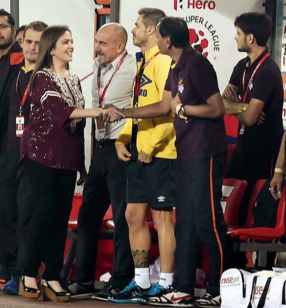 Nita Ambani with Atletico de Kolkatas coach Antonio Lopez Habas during the Semi Final Match against FC Goa at Salt Lake Stadium in Kolkata.