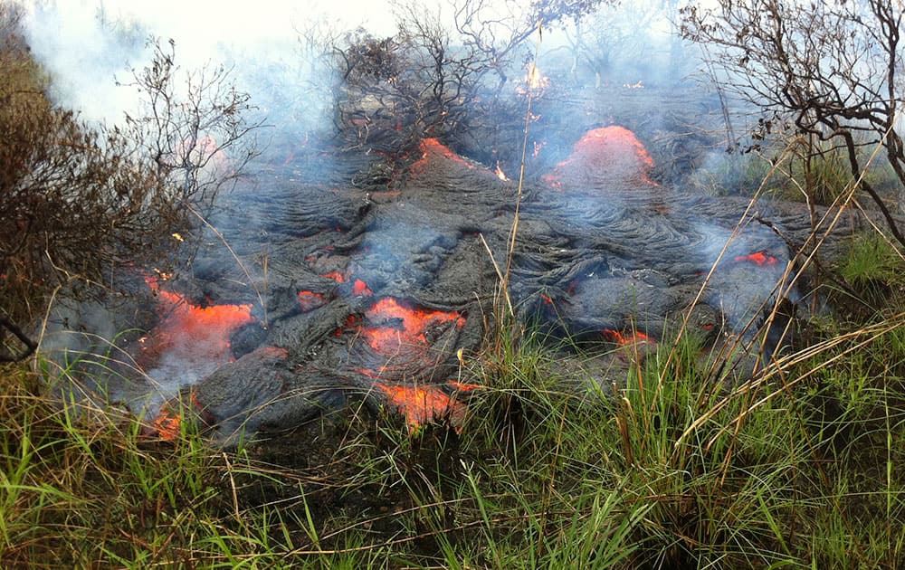 the active lava flow front continues to advance downslope towards the northeast about a mile and a half from the marketplace in Pahoa, Hawaii.