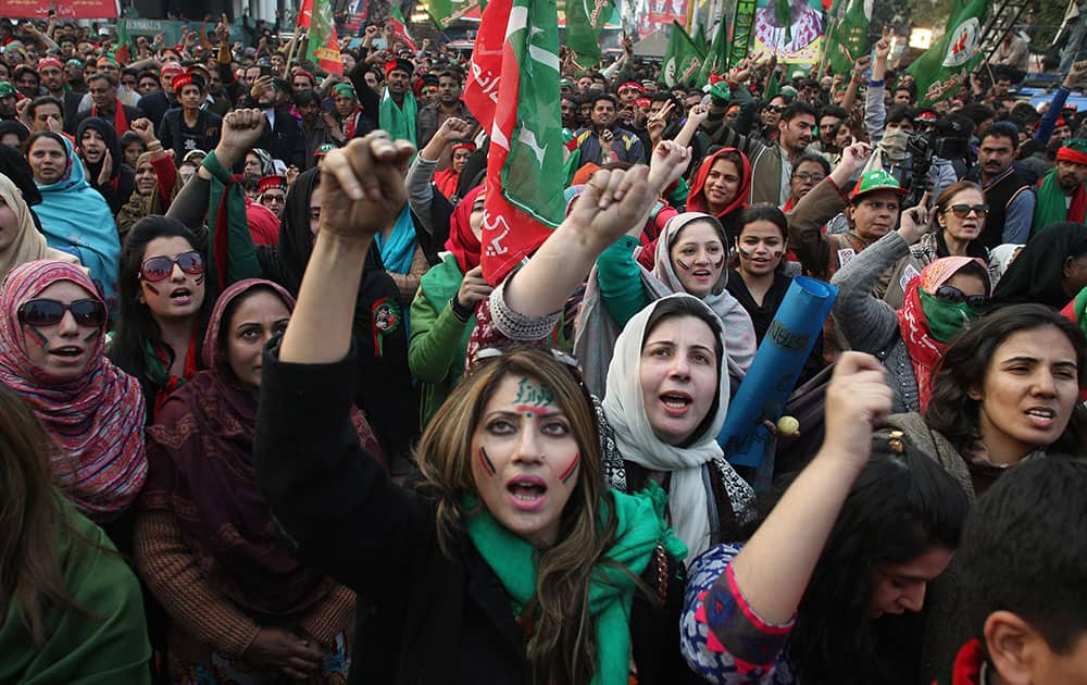 Supporters of Pakistan's cricketer-turn-politician Imran Khan, leader of Pakistan Tehrik-e-Insaf chant slogans during an anti-government protest in Lahore, Pakistan.