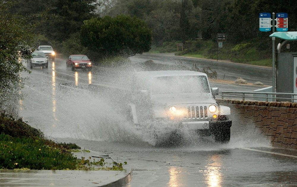 Heavy rain caused roadways to flood, in Monterey, Calif. A new storm dumped more rain on already waterlogged parts of Northern California, causing minor road flooding, scattered power outages and airport delays.