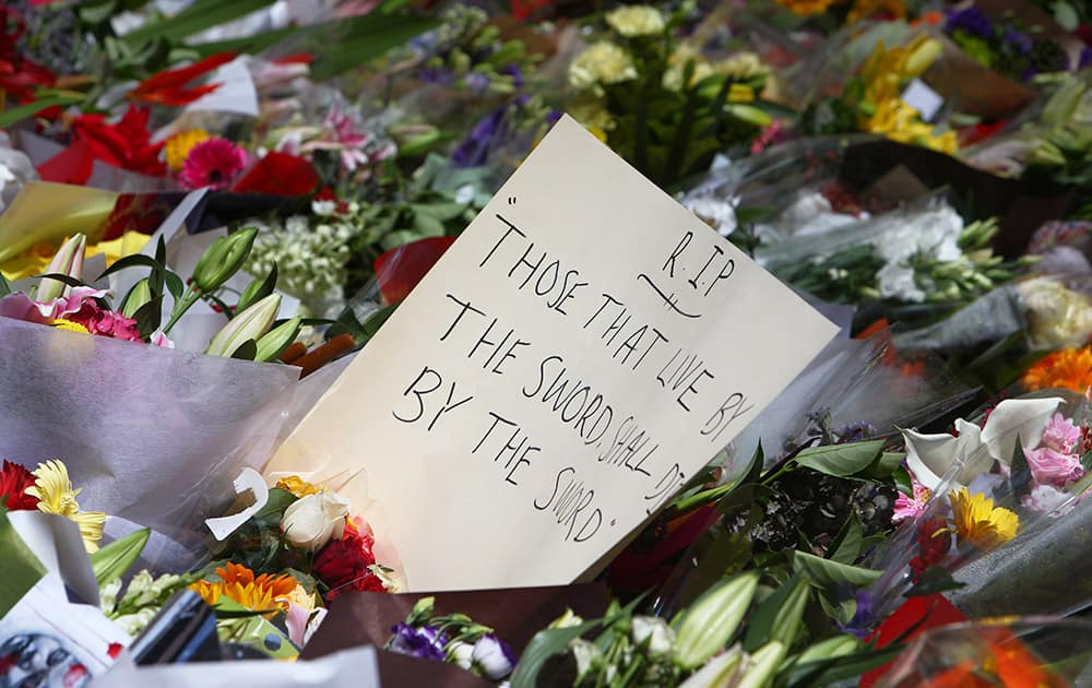 A message to the shooting victims is placed at a makeshift memorial at Martin Place in the central business district of Sydney.