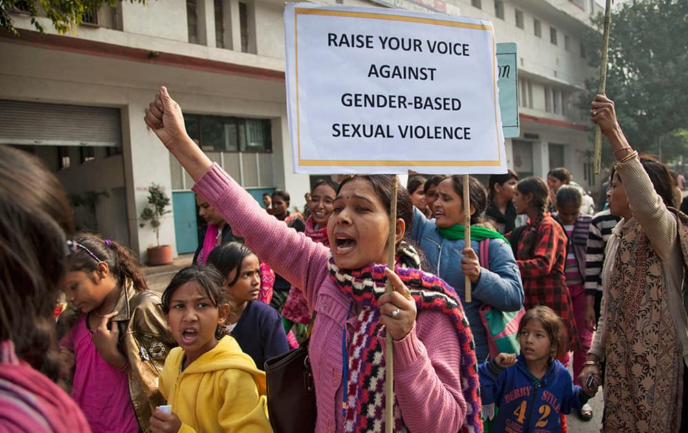 Activists of Apne Aap, a non-governmental organization which addresses to women's rights, shout slogans during a protest ahead of the second anniversary of the deadly gang rape of a 23-year-old physiotherapy student on a bus, in New Delhi, India.