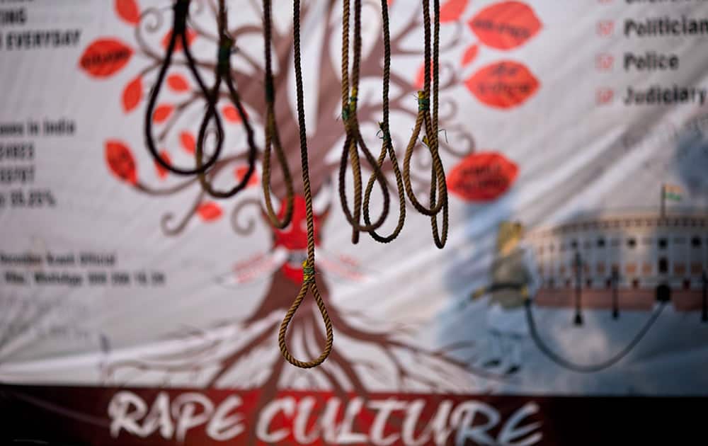 Hanging ropes are displayed as part of an installation seeking death penalty for rapists on the second anniversary of the deadly gang rape of a student on a bus, in New Delhi, India.