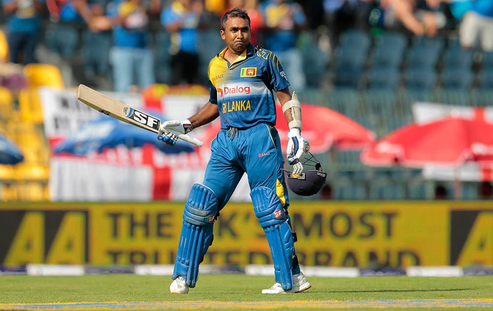 Sri Lankan batsman Mahela Jayawardene acknowledges the crowd as he leaves the field after being dismissed in his final innings in home ground during the seventh one day international cricket match against England in Colombo, Sri Lanka.