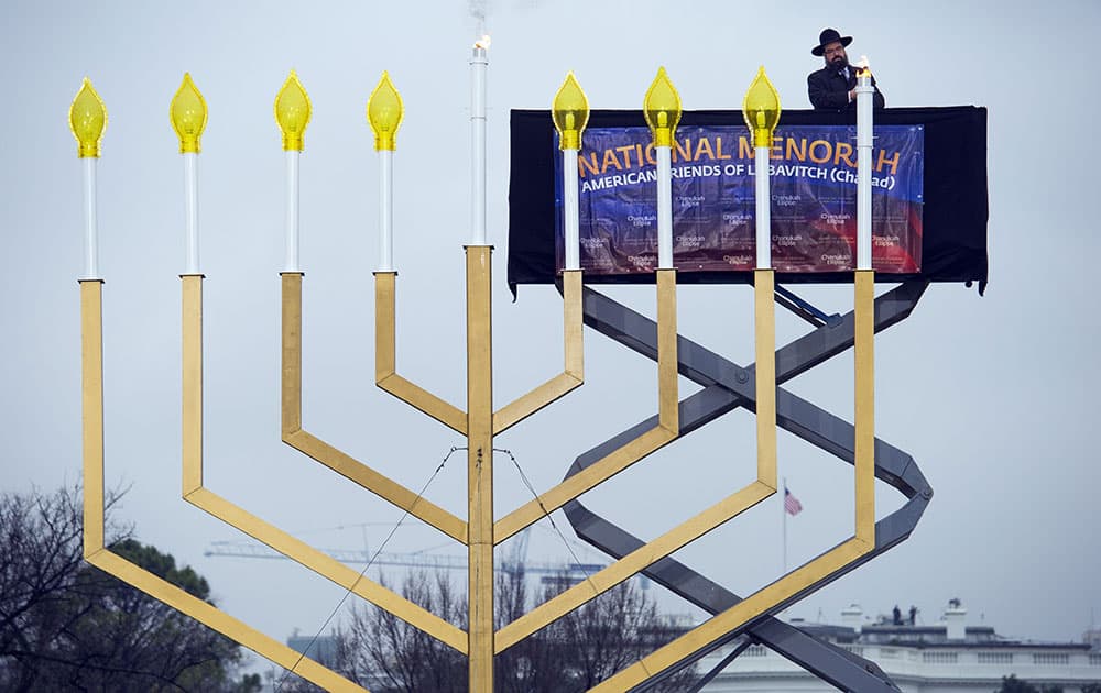 Rabbi Abraham Shemtov,national director of American Friends of Lubavitch (Chabad) lights the national menorah during a ceremony marking the start of the celebration of Hanukkah, on the Ellipse near the White House in Washington.
