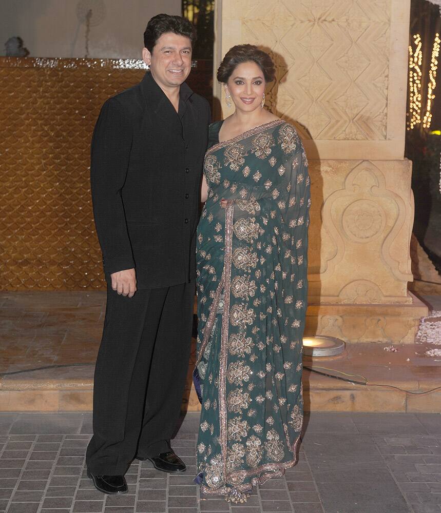 Sriram Nene, Madhuri Dixit Nene during Riddhi Malhotra and Tejas Talwalkar marriage reception in Mumbai.- dna