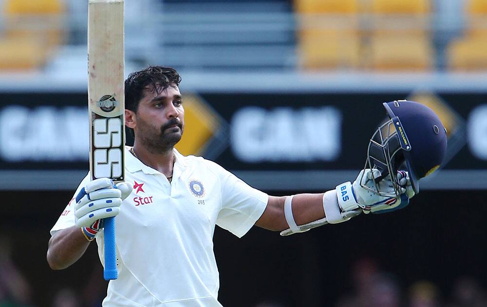 India's Murali Vijay celebrates after scoring a century on day one of the second cricket test against Australia in Brisbane, Australia.