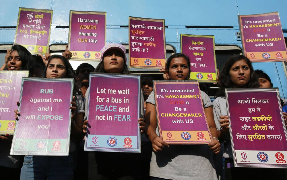 Indian students hold placards during a rally to mark the second anniversary of the deadly gang rape of a student on a bus in New Delhi, in Mumbai, India.