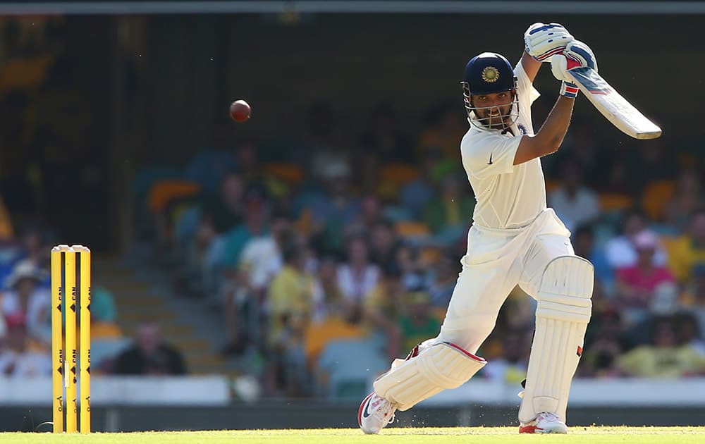 Ajinkya Rahane plays a shot during play on day one of the second cricket test against Australia in Brisbane.