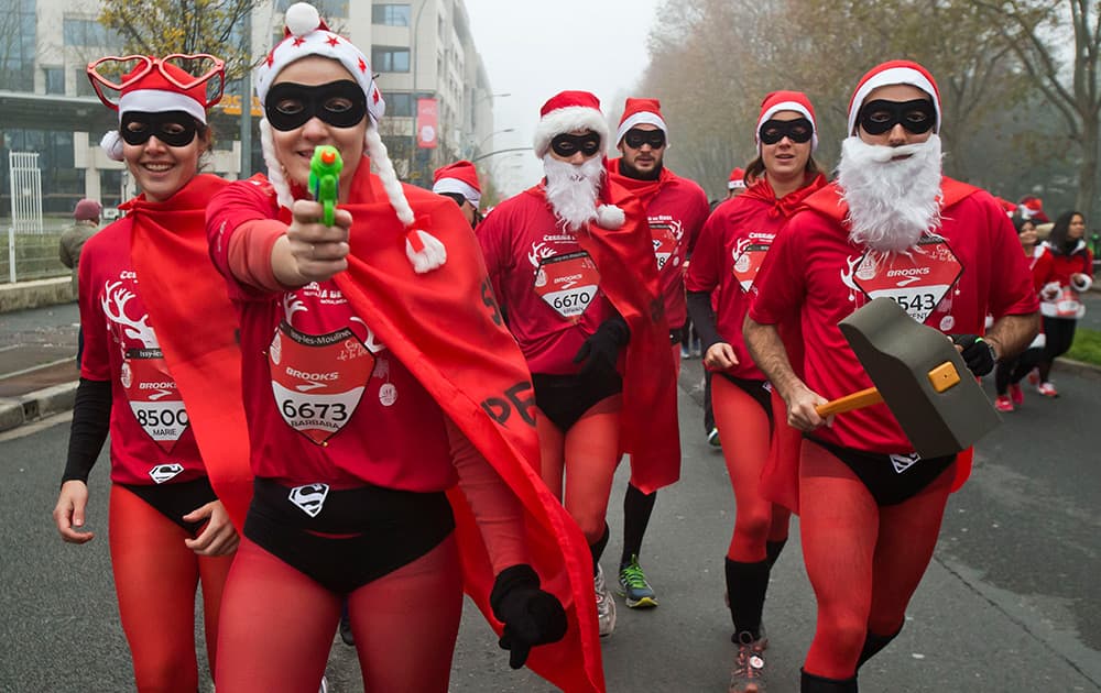 Runners, dressed as Santa Claus, take part in the 38th 