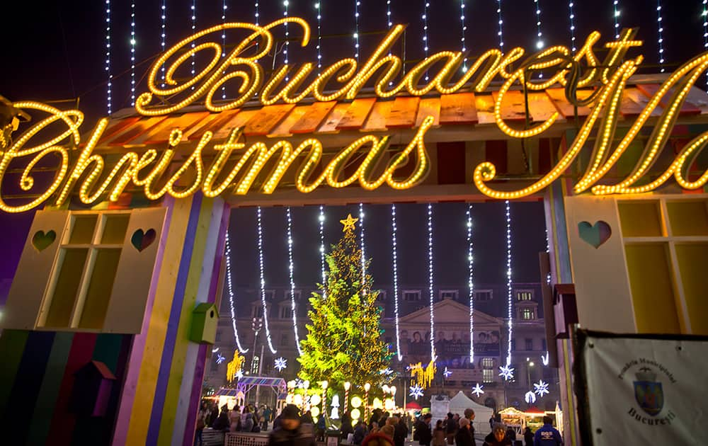 People walk at a Christmas fair in central Bucharest, Romania.