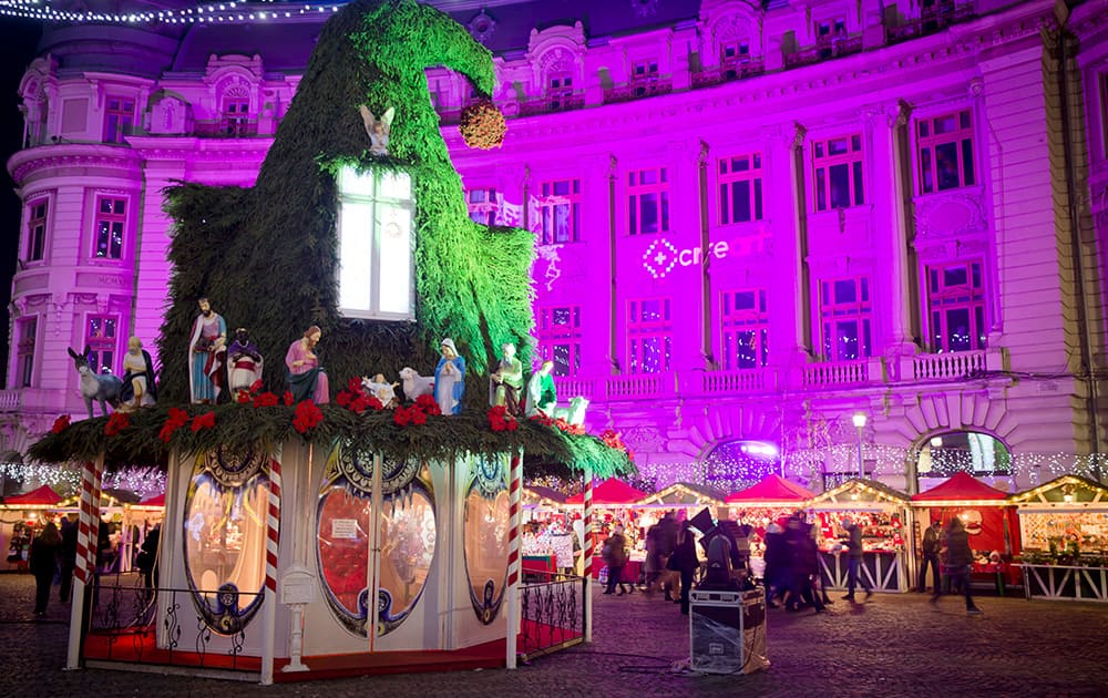 People walk at a Christmas fair in central Bucharest, Romania.